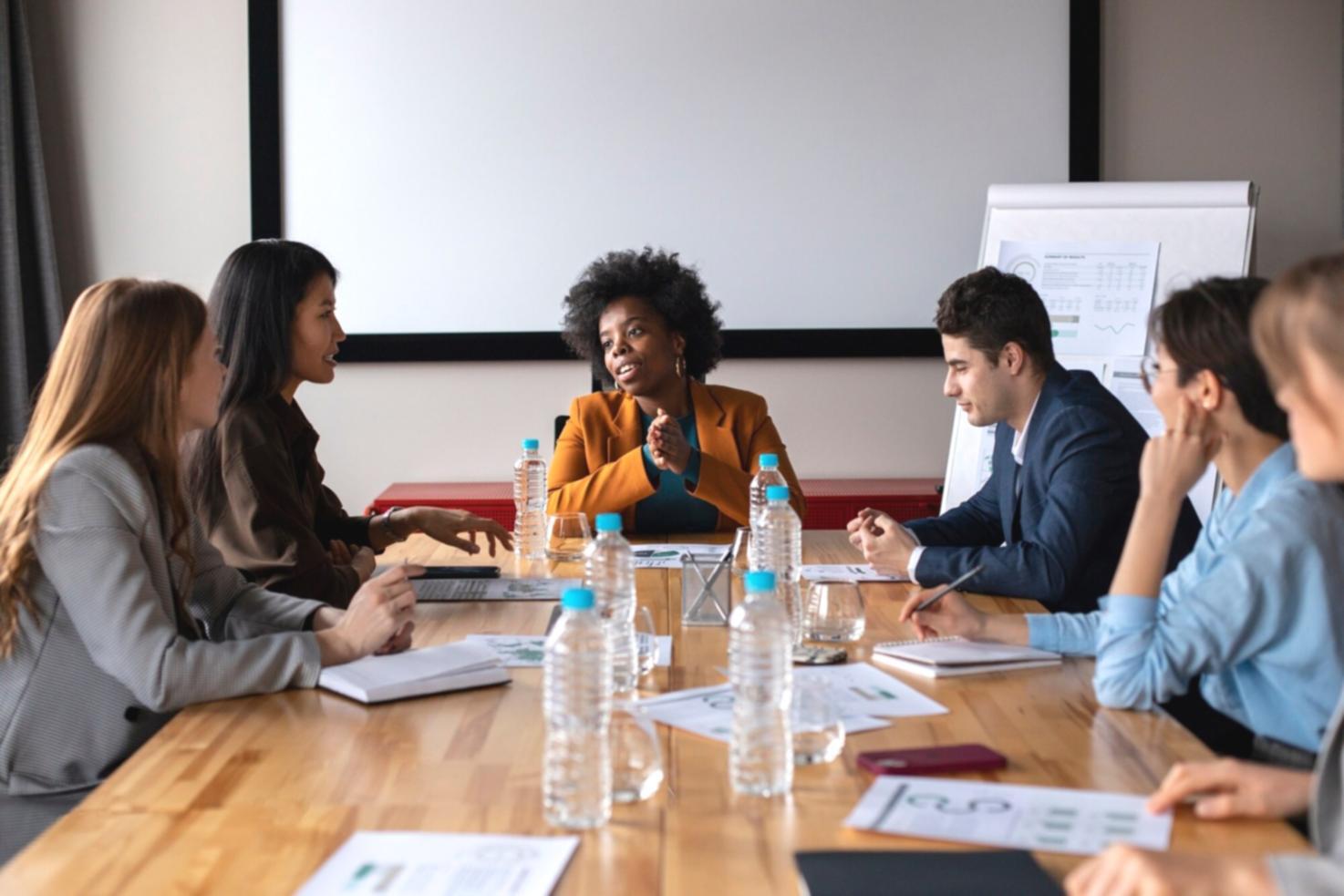 Family discussing budget plans at kitchen table